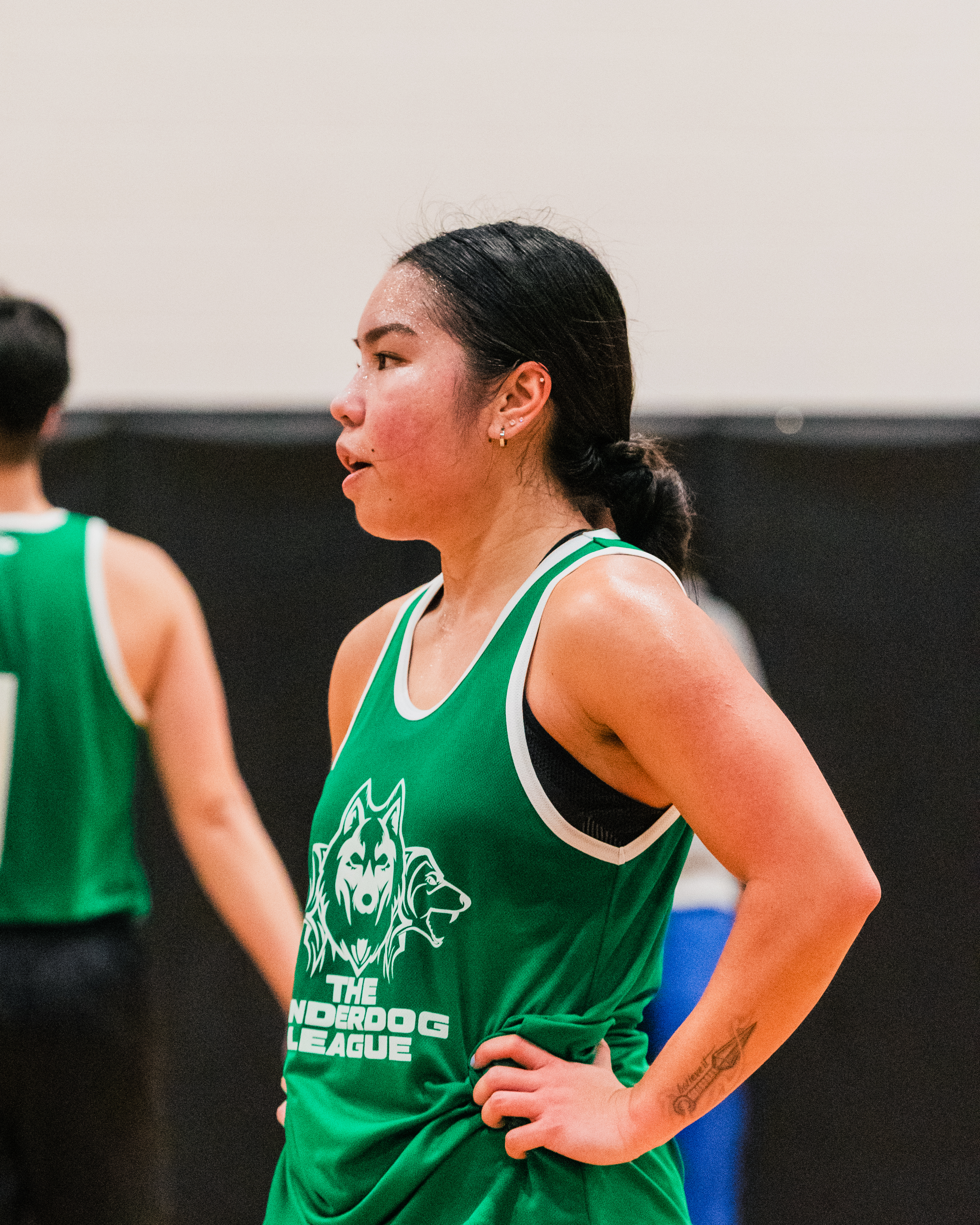 Jan looking left with hands on her hips