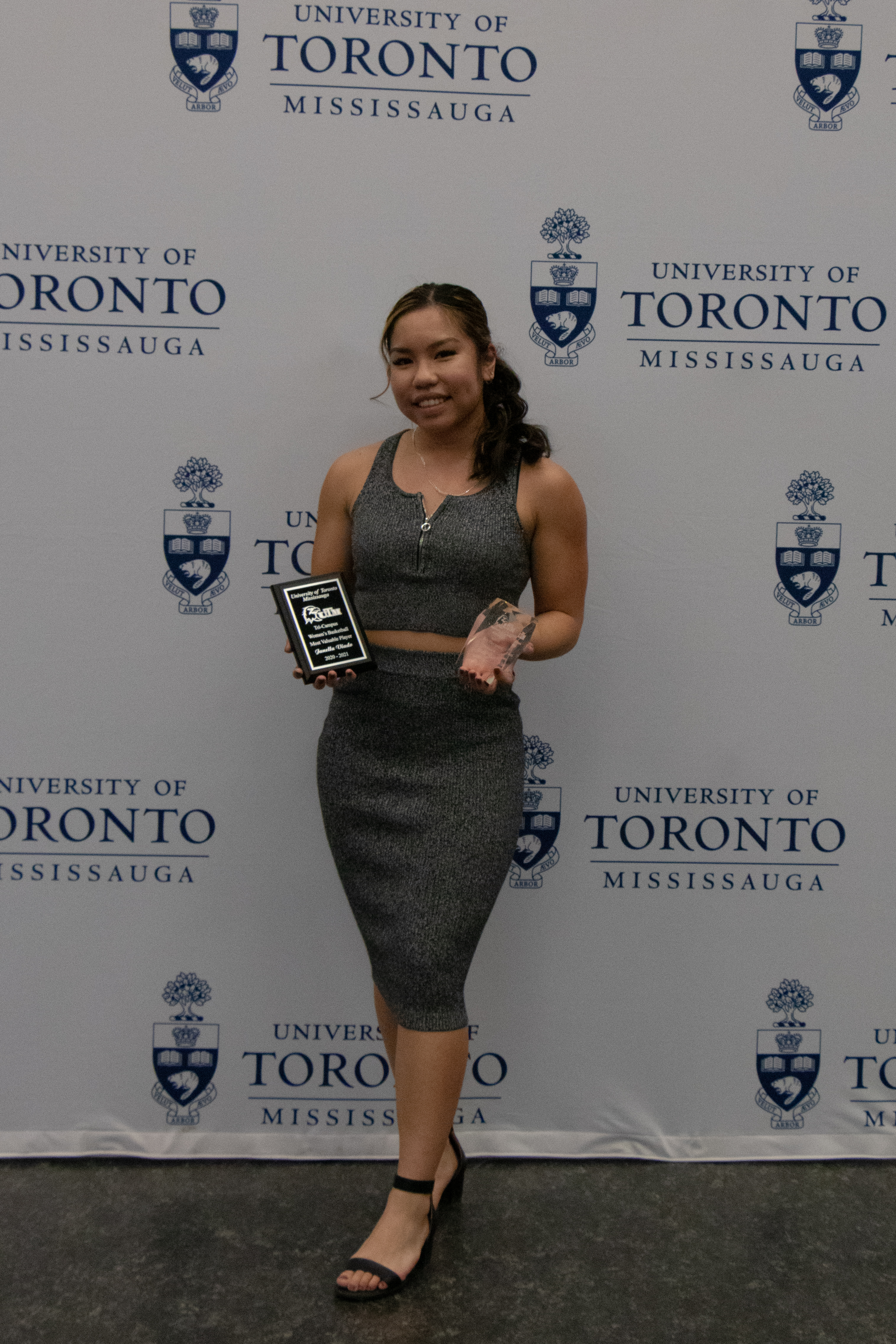 Jan holding 2 awards