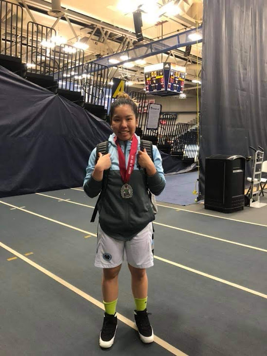 Photo of Jan Viado wearing a JUEL medal
