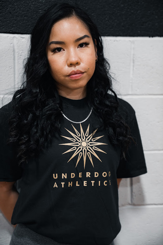 Jan looking at the camera with Underdog Athletics Shirt